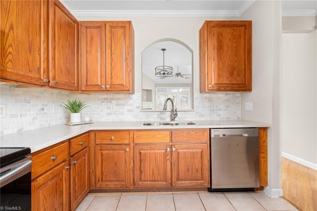 kitchen with light tile patterned flooring, crown molding, decorative backsplash, sink, and dishwasher