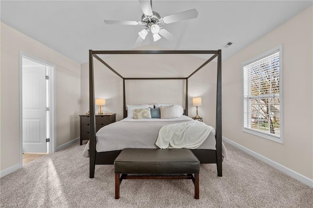 bedroom featuring ceiling fan and light colored carpet