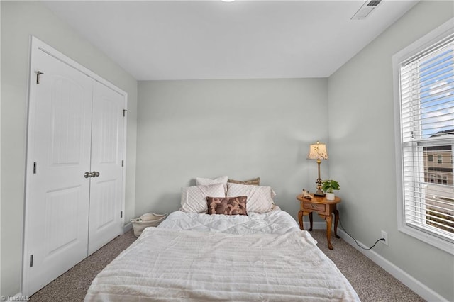 carpeted bedroom with a closet