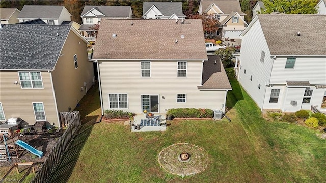 rear view of house with cooling unit