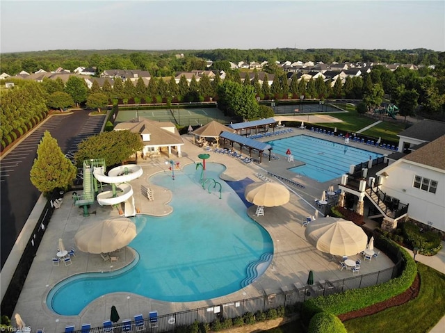 view of pool with a patio area and a water slide