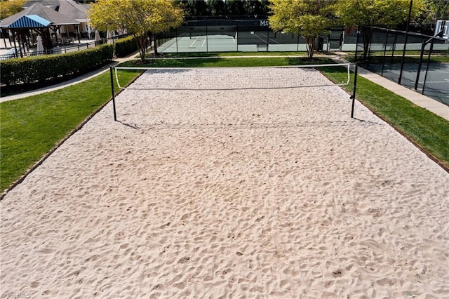 surrounding community with tennis court