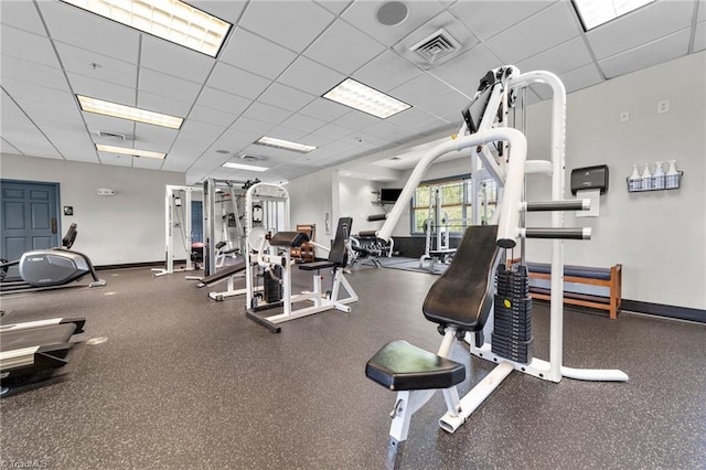 exercise room featuring a drop ceiling