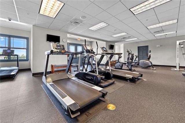 workout area featuring a paneled ceiling