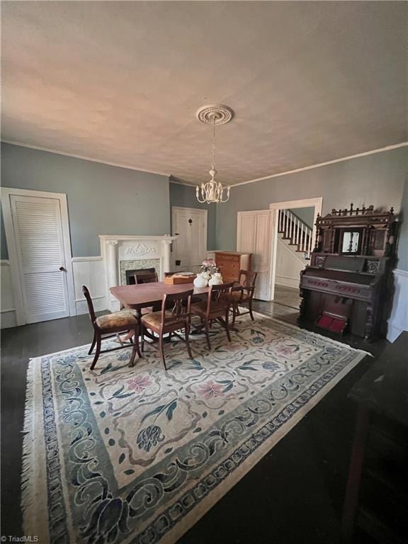 dining room with hardwood / wood-style flooring and an inviting chandelier