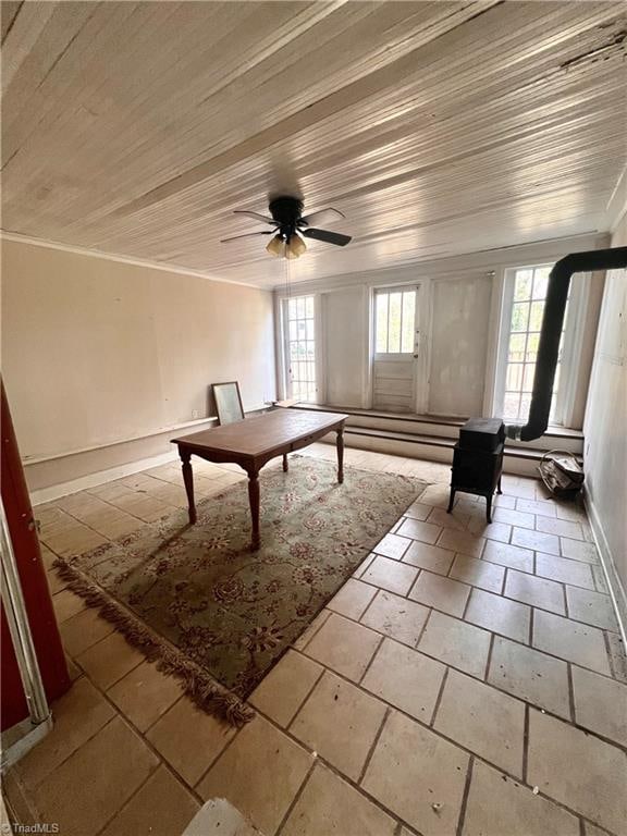 interior space with crown molding, a healthy amount of sunlight, and ceiling fan