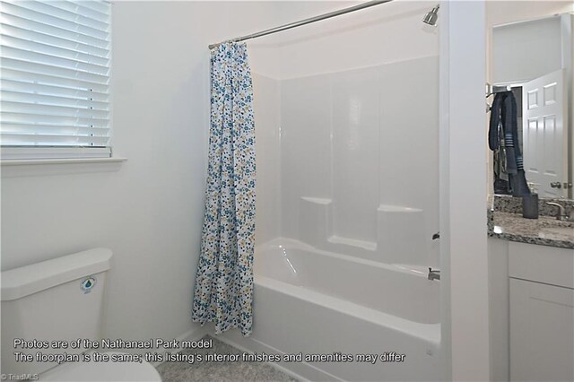 bathroom with toilet, shower / bath combination with curtain, and vanity