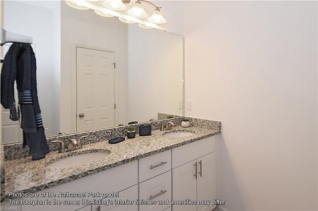 bathroom with a sink and double vanity