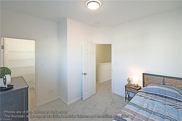 bedroom featuring baseboards and carpet