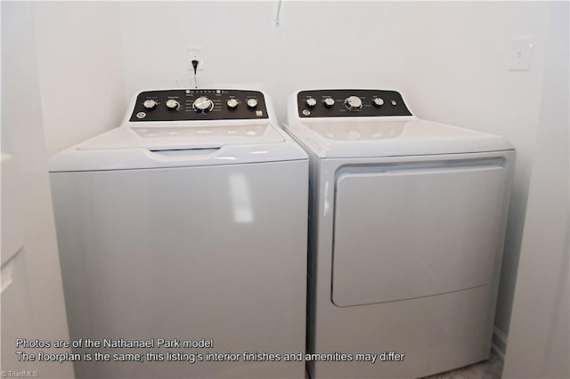 washroom featuring laundry area and independent washer and dryer