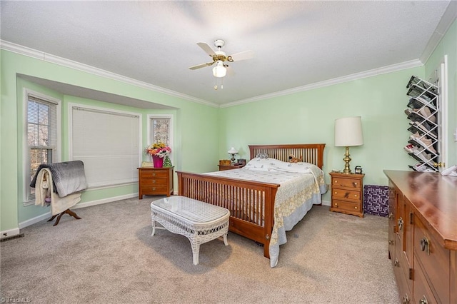 bedroom featuring ornamental molding, light colored carpet, and ceiling fan