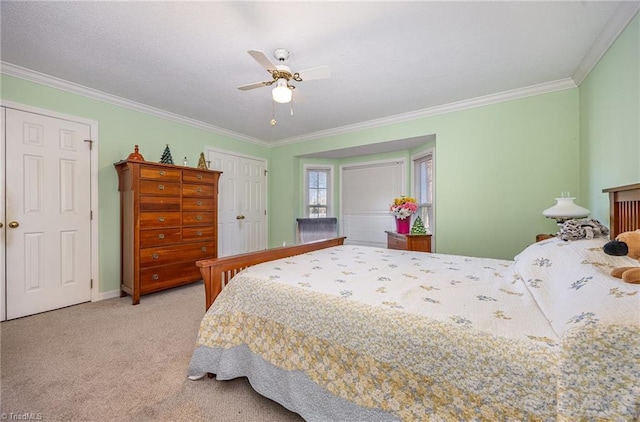 bedroom with ornamental molding, light colored carpet, and ceiling fan