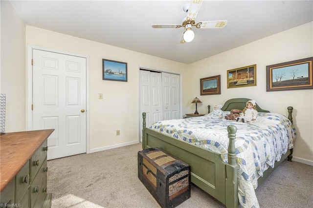 bedroom featuring light carpet, a closet, and ceiling fan