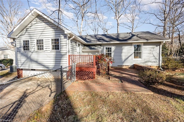 back of property featuring a wooden deck and central AC unit