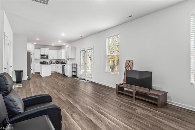 living room featuring dark hardwood / wood-style floors