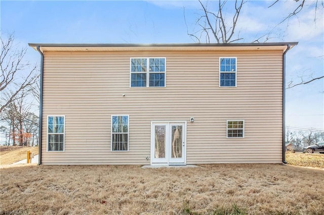 rear view of house with a lawn