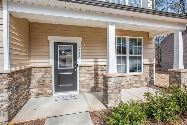 doorway to property featuring a porch