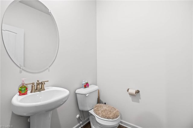 bathroom with toilet and sink