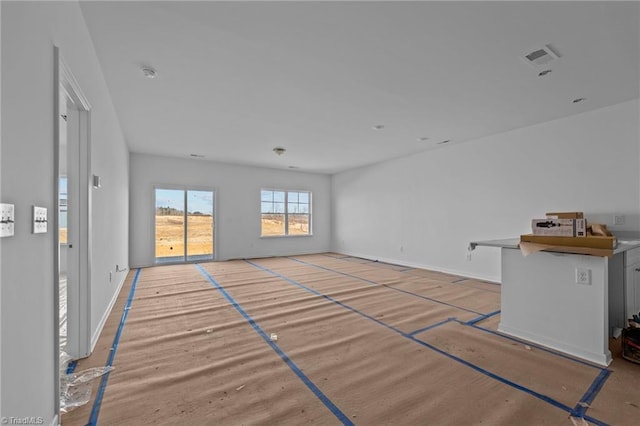 unfurnished living room with basketball court