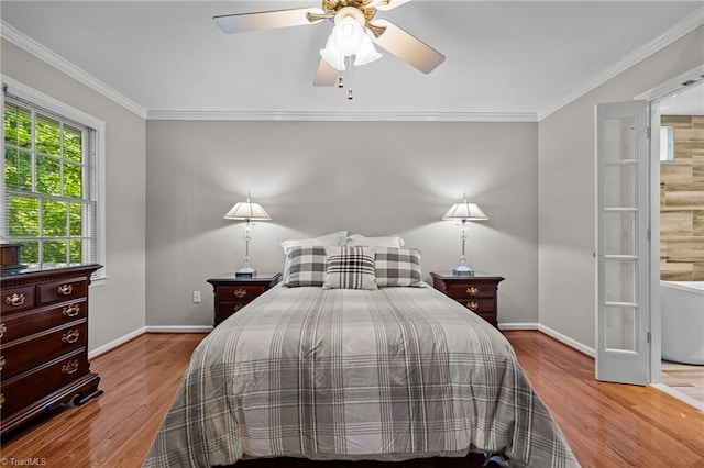 1005 Stuart Dr, Mebane, NC 27302 - bedroom with baseboards, ornamental molding, and wood finished floors