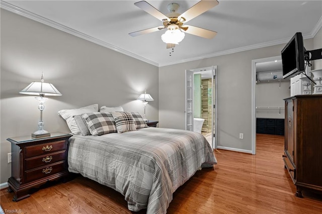 1005 Stuart Dr, Mebane, NC 27302 - bedroom featuring crown molding, ceiling fan, baseboards, ensuite bathroom, and light wood-type flooring