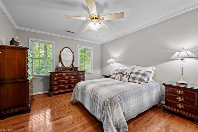 1005 Stuart Dr, Mebane, NC 27302 - bedroom with visible vents, ornamental molding, baseboards, and wood finished floors