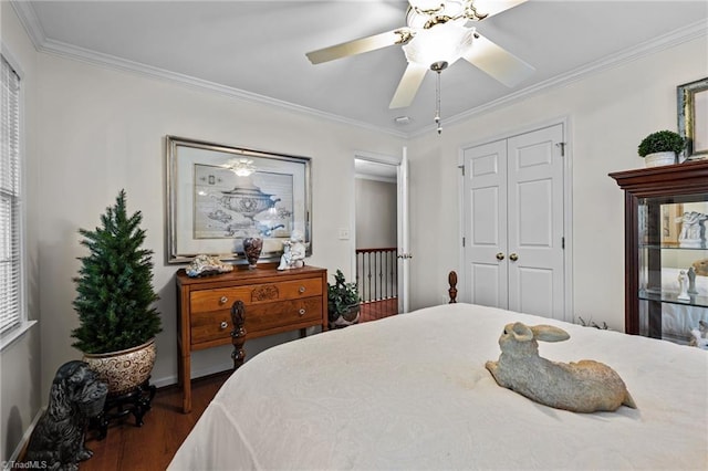 1005 Stuart Dr, Mebane, NC 27302 - bedroom with crown molding, baseboards, ceiling fan, and dark wood-style flooring