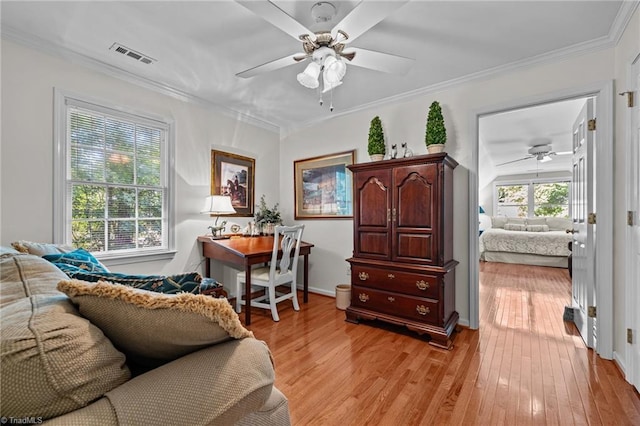 1005 Stuart Dr, Mebane, NC 27302 - sitting room featuring light wood-style floors, ceiling fan, ornamental molding, and visible vents