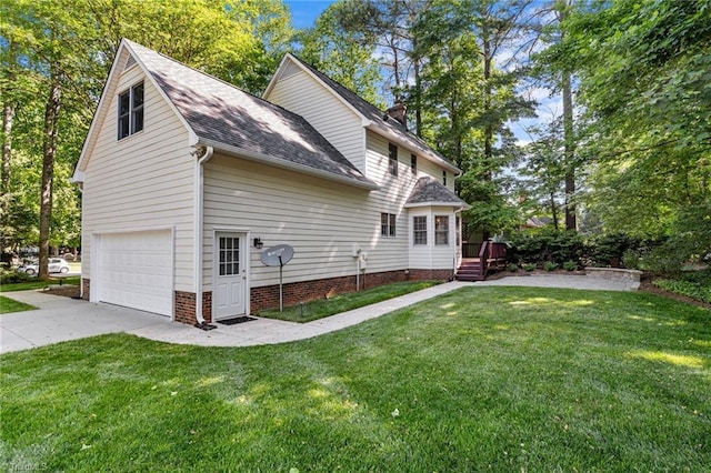 1005 Stuart Dr, Mebane, NC 27302 - rear view of house with a lawn, a chimney, and concrete driveway