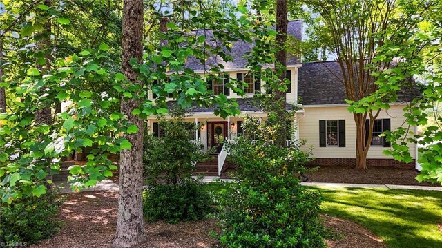 1005 Stuart Dr, Mebane, NC 27302 - view of front facade featuring a shingled roof