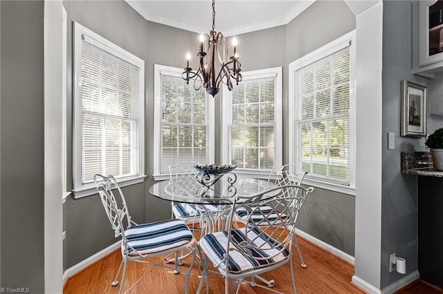 1005 Stuart Dr, Mebane, NC 27302 - dining area with an inviting chandelier, baseboards, ornamental molding, and wood finished floors