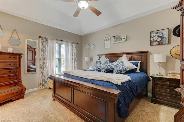 carpeted bedroom with vaulted ceiling and ceiling fan