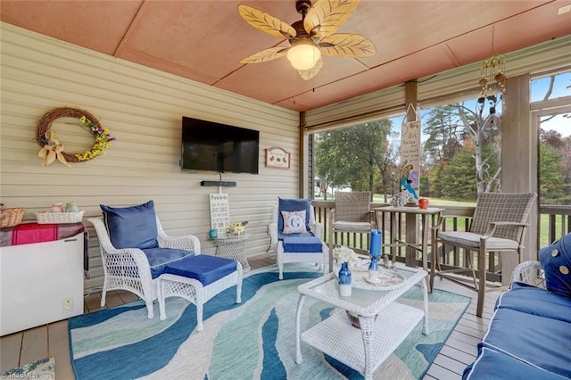 sunroom / solarium with ceiling fan