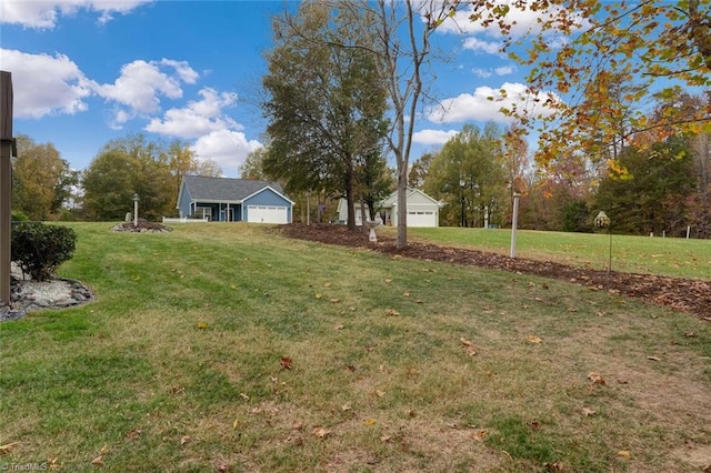 view of yard featuring a garage