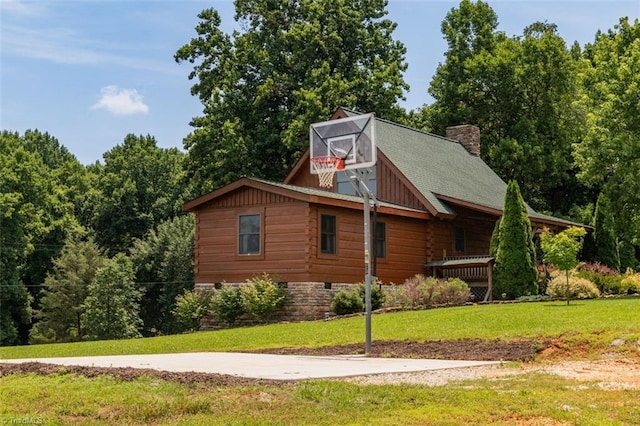 158 Cottontail Ln, North Wilkesboro, NC 28659 - view of home's exterior featuring a chimney, a yard, and log siding