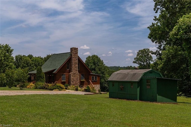 158 Cottontail Ln, North Wilkesboro, NC 28659 - view of front of property featuring a chimney, a front lawn, and an outbuilding