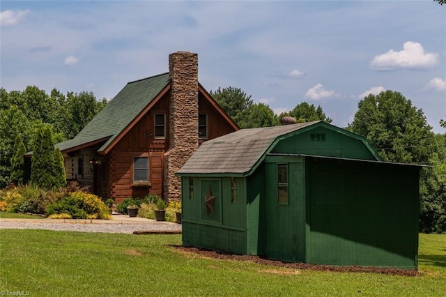 158 Cottontail Ln, North Wilkesboro, NC 28659 - view of property exterior featuring a lawn and a chimney