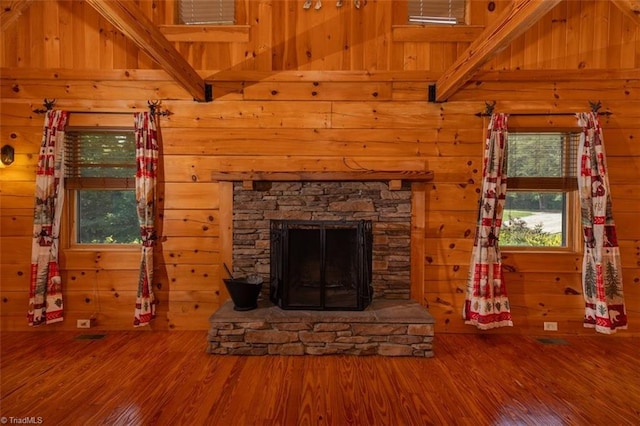 158 Cottontail Ln, North Wilkesboro, NC 28659 - unfurnished living room with wood finished floors, a stone fireplace, and wooden walls