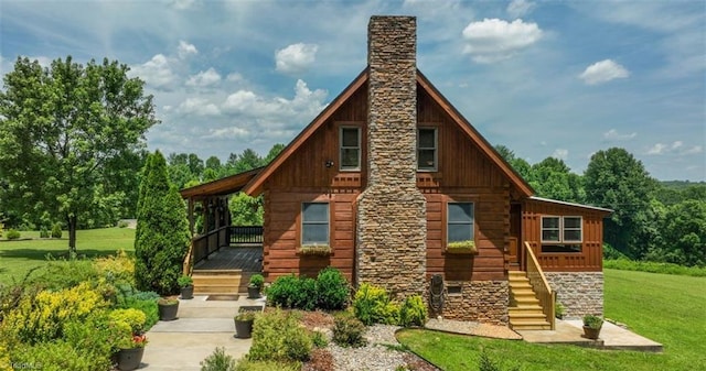 158 Cottontail Ln, North Wilkesboro, NC 28659 - view of front of house featuring a front yard, a chimney, and stairway
