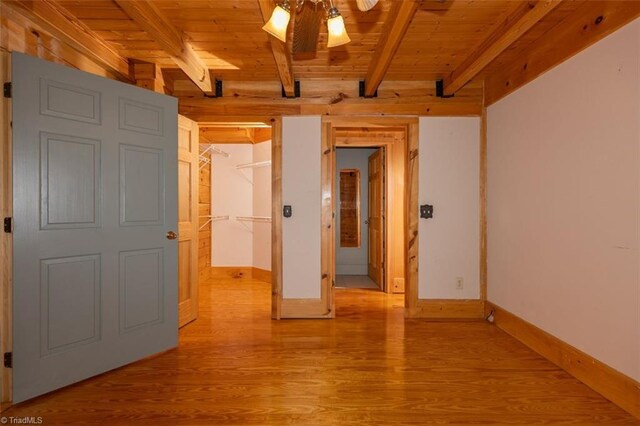158 Cottontail Ln, North Wilkesboro, NC 28659 - unfurnished room featuring a wood ceiling with exposed beams, light wood-style flooring, and a ceiling fan