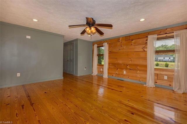 158 Cottontail Ln, North Wilkesboro, NC 28659 - spare room featuring plenty of natural light, a ceiling fan, a textured ceiling, wood finished floors, and recessed lighting