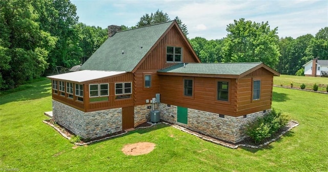 158 Cottontail Ln, North Wilkesboro, NC 28659 - rear view of house featuring a yard, stone siding, a shingled roof, and a chimney
