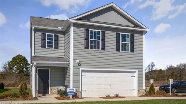 view of front of property with a garage