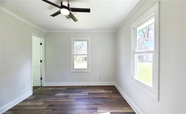 empty room with crown molding, ceiling fan, dark wood-type flooring, and baseboards