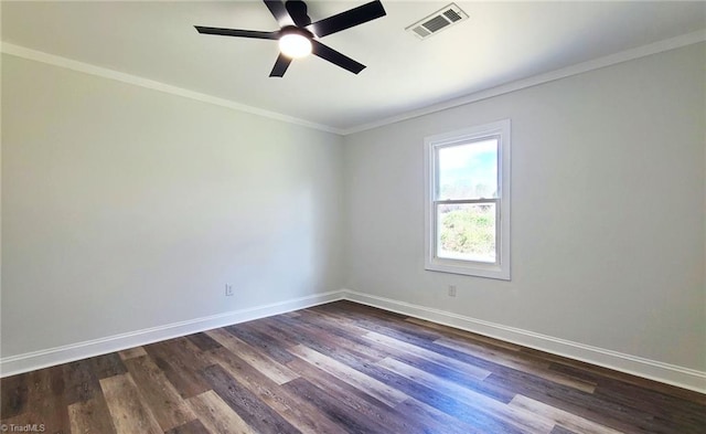 unfurnished room with baseboards, visible vents, dark wood-style flooring, and ornamental molding