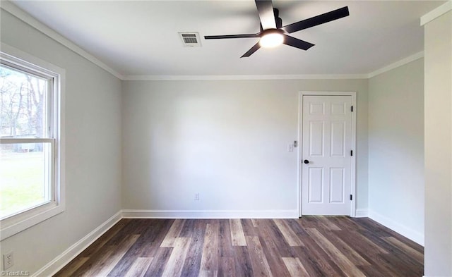 unfurnished room with crown molding, baseboards, and dark wood-style flooring