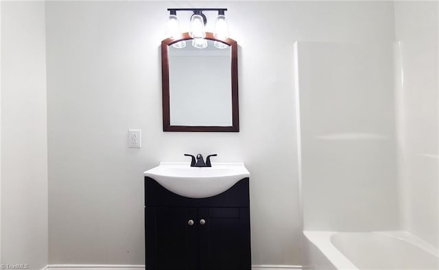 bathroom with vanity and baseboards