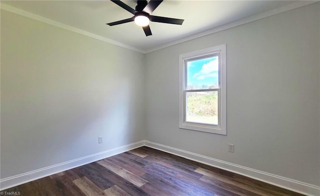 empty room featuring ornamental molding, dark wood finished floors, baseboards, and a ceiling fan