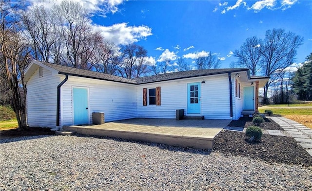 rear view of property featuring a patio