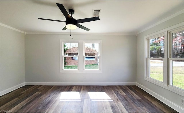 spare room with a healthy amount of sunlight, dark wood-style floors, and baseboards